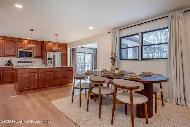 a kitchen with stainless steel appliances granite countertop a sink and cabinets