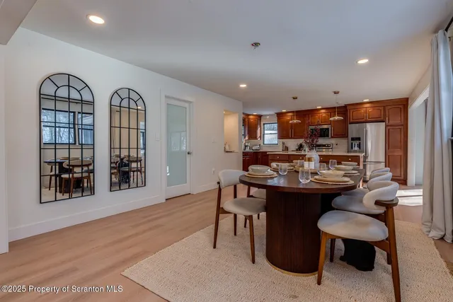 a kitchen with a sink window and cabinets