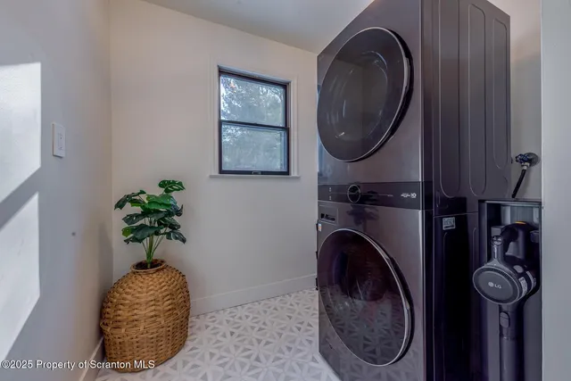 a view of a house with a yard covered in snow