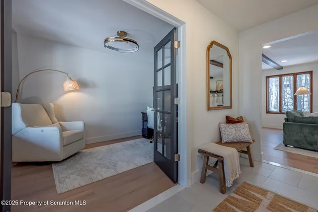 a view of a dining room with furniture and window