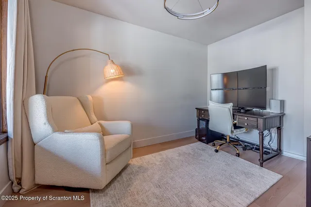 a view of a dining room with furniture and window