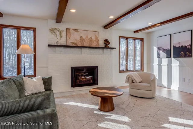a front view of a house with dining table and chairs