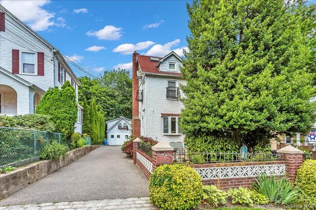 a house view with a garden space