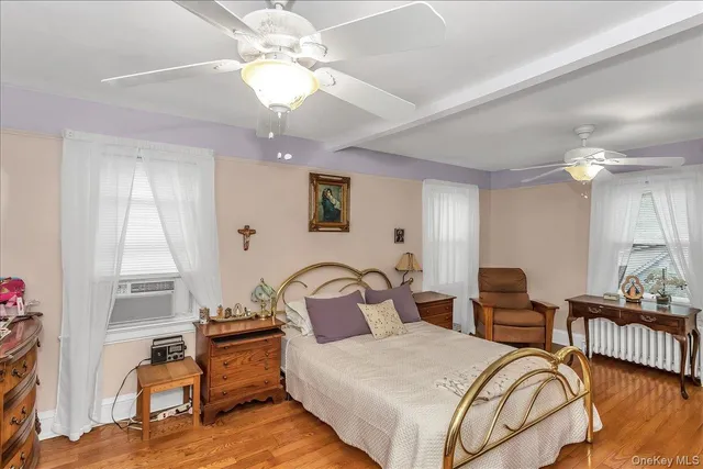 a bedroom with furniture and a chandelier