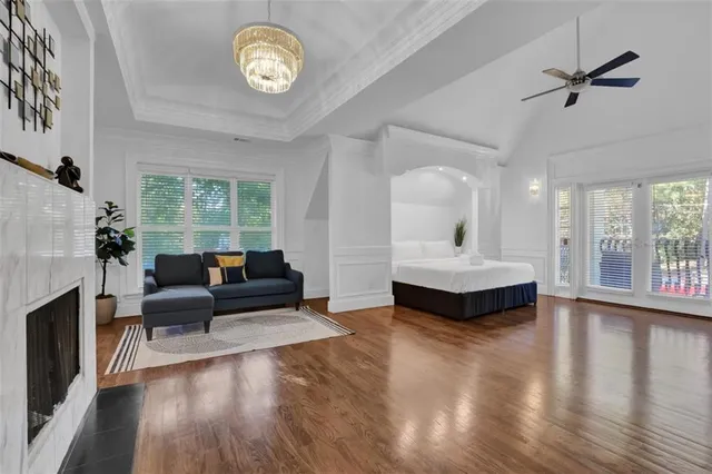 a view of a patio with table and chairs with wooden floor and fence