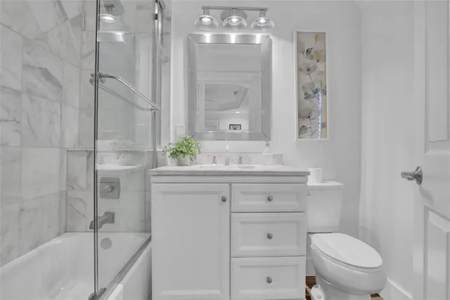 a kitchen with stainless steel appliances granite countertop a refrigerator and cabinets