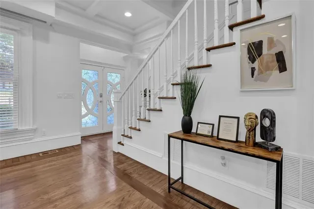 a kitchen with stainless steel appliances kitchen island granite countertop a sink cabinets and microwave