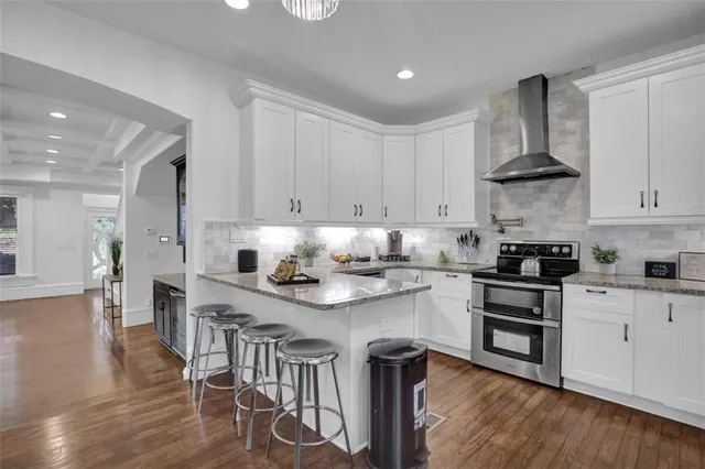 a bathroom with bathtub and window