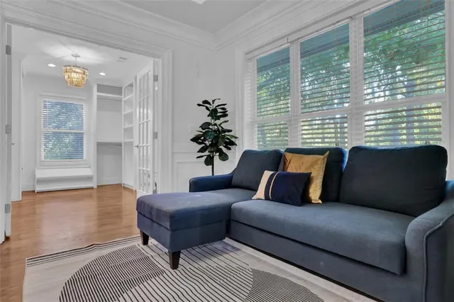 a backyard of a house with wooden floor and outdoor seating