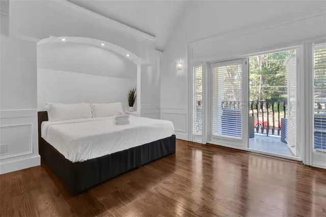 a bathroom with a sink mirror vanity and toilet