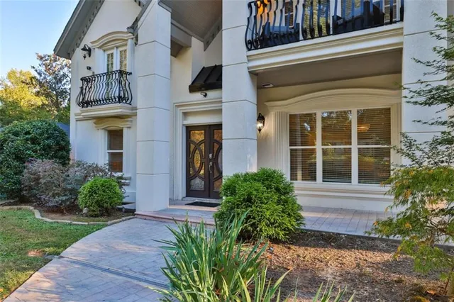 a bathroom with a sink a toilet and shower curtain