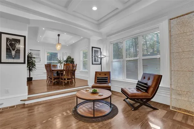a view of a dining room with furniture window and wooden floor