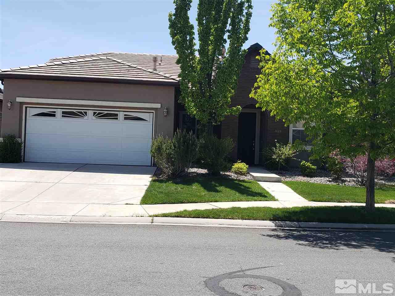 1680 Emerald Bay Drive Reno, NV 89521 - Photo 1 of 27 a front view of a house with garden