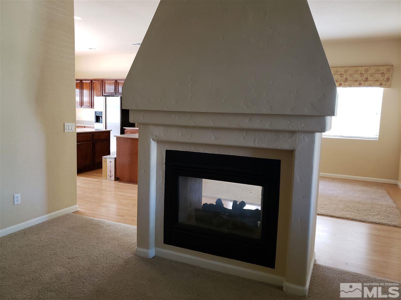 1680 Emerald Bay Drive Reno, NV 89521 - Photo 11 of 27 a view of an empty room with a fireplace