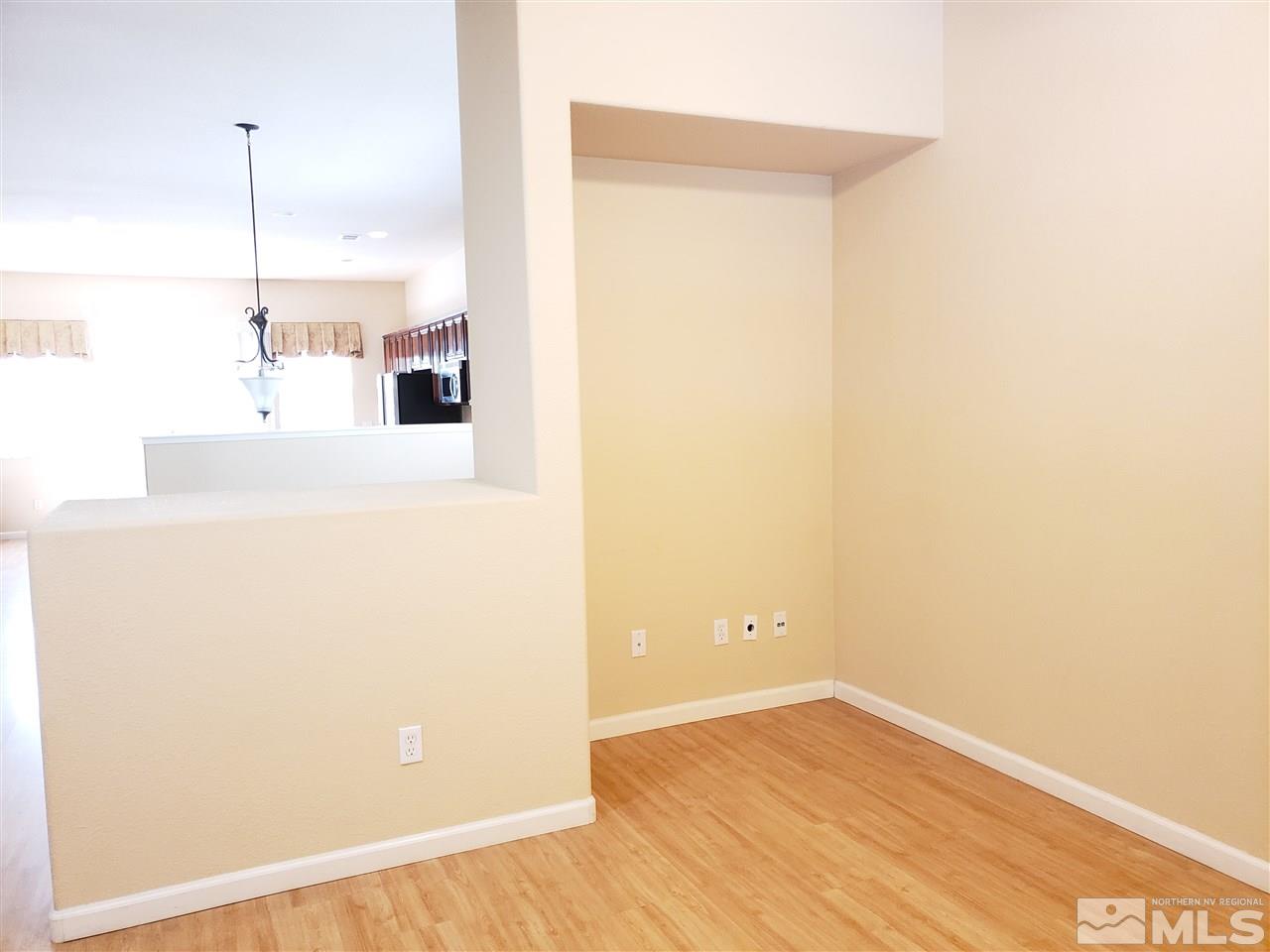 1680 Emerald Bay Drive Reno, NV 89521 - Photo 12 of 27 a view of a room with wooden floor and an empty room