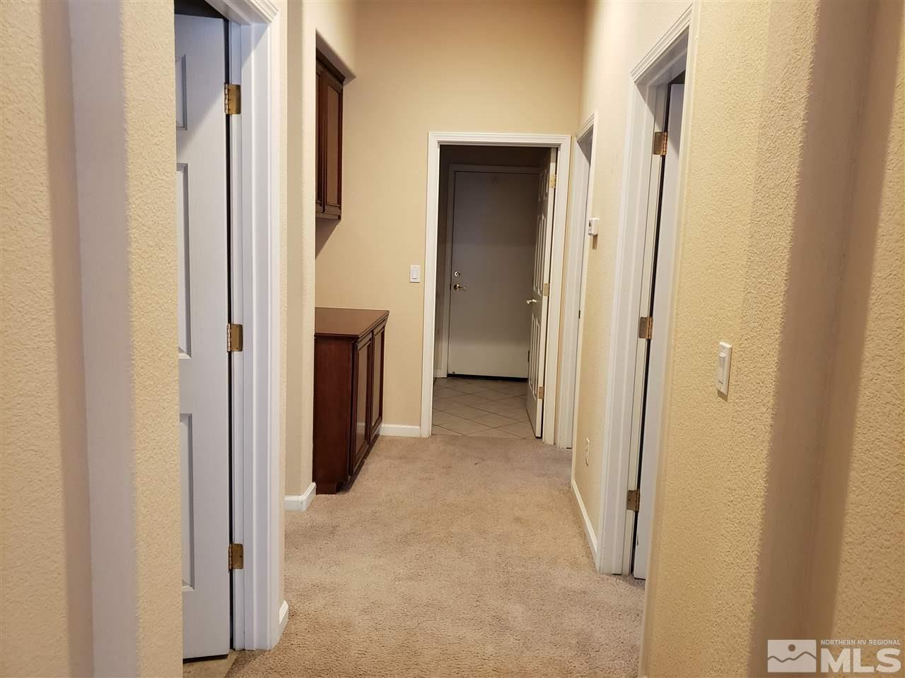 1680 Emerald Bay Drive Reno, NV 89521 - Photo 17 of 27 a view of a hallway with hallway and wooden floor