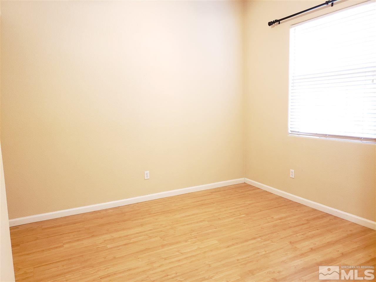 1680 Emerald Bay Drive Reno, NV 89521 - Photo 21 of 27 a view of a small space with wooden floor and a window