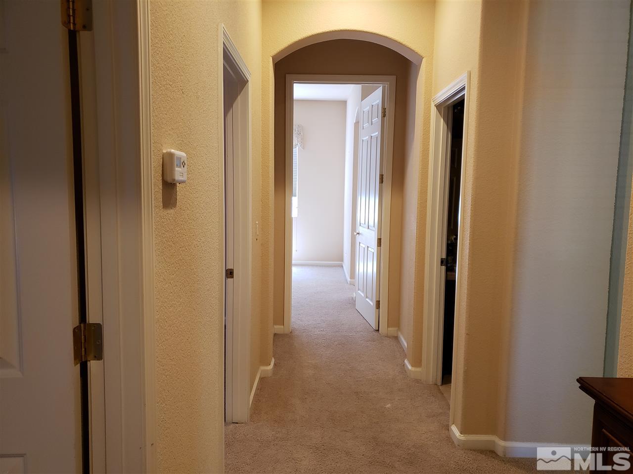 1680 Emerald Bay Drive Reno, NV 89521 - Photo 22 of 27 a view of a bathroom from a hallway