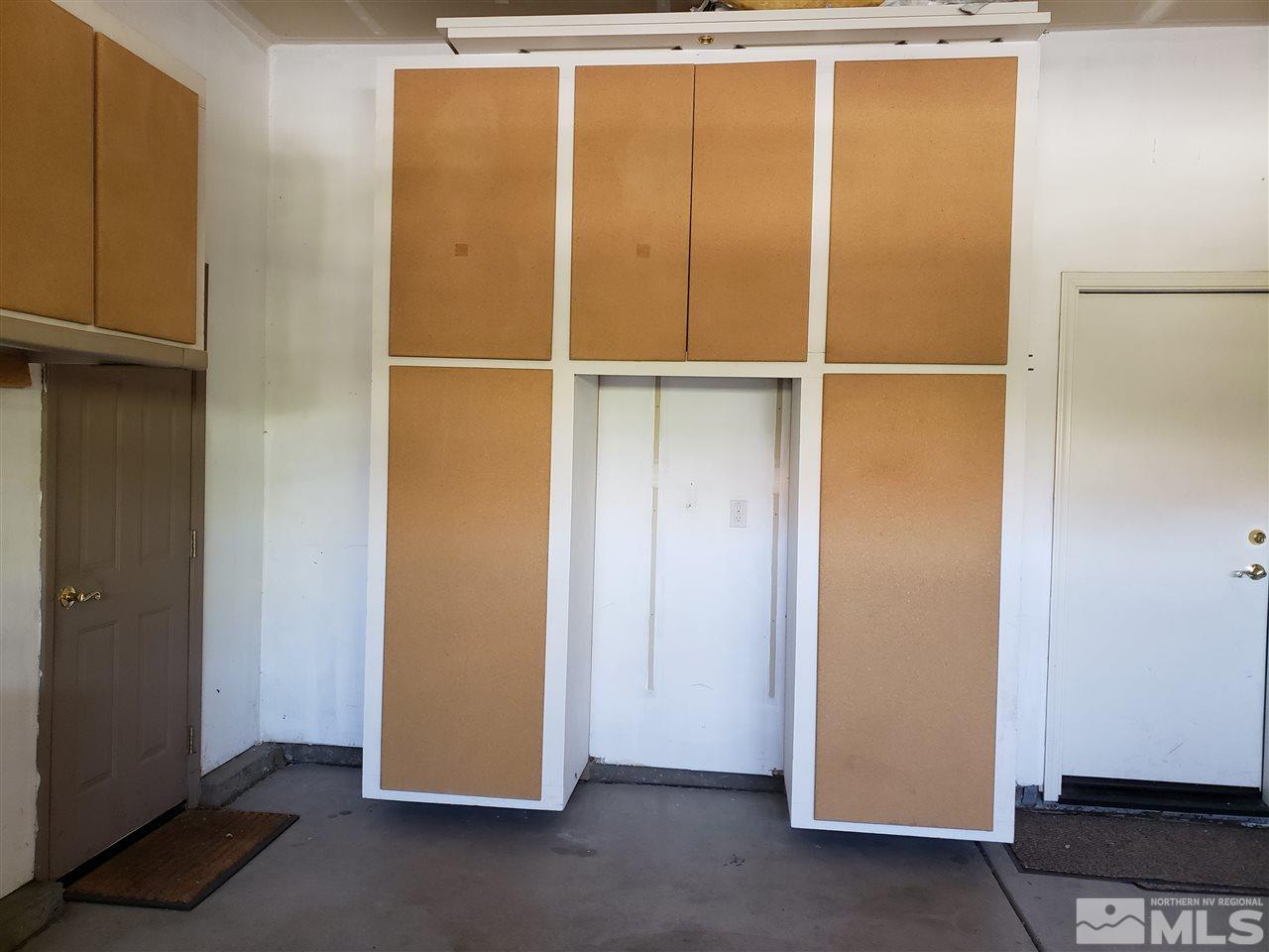 1680 Emerald Bay Drive Reno, NV 89521 - Photo 25 of 27 a view of an empty room with wooden floor and cabinet