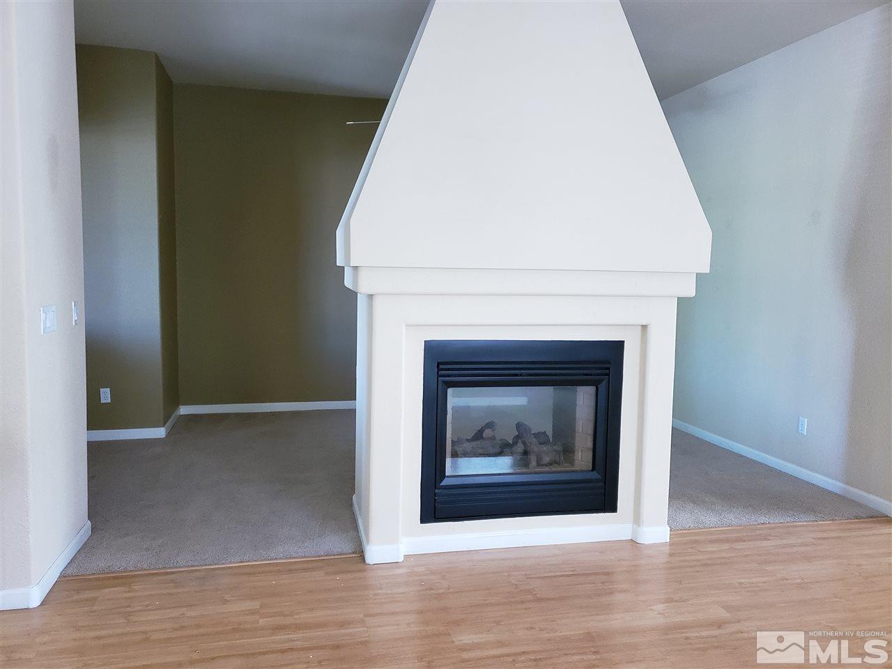 1680 Emerald Bay Drive Reno, NV 89521 - Photo 10 of 27 a living room with a fireplace