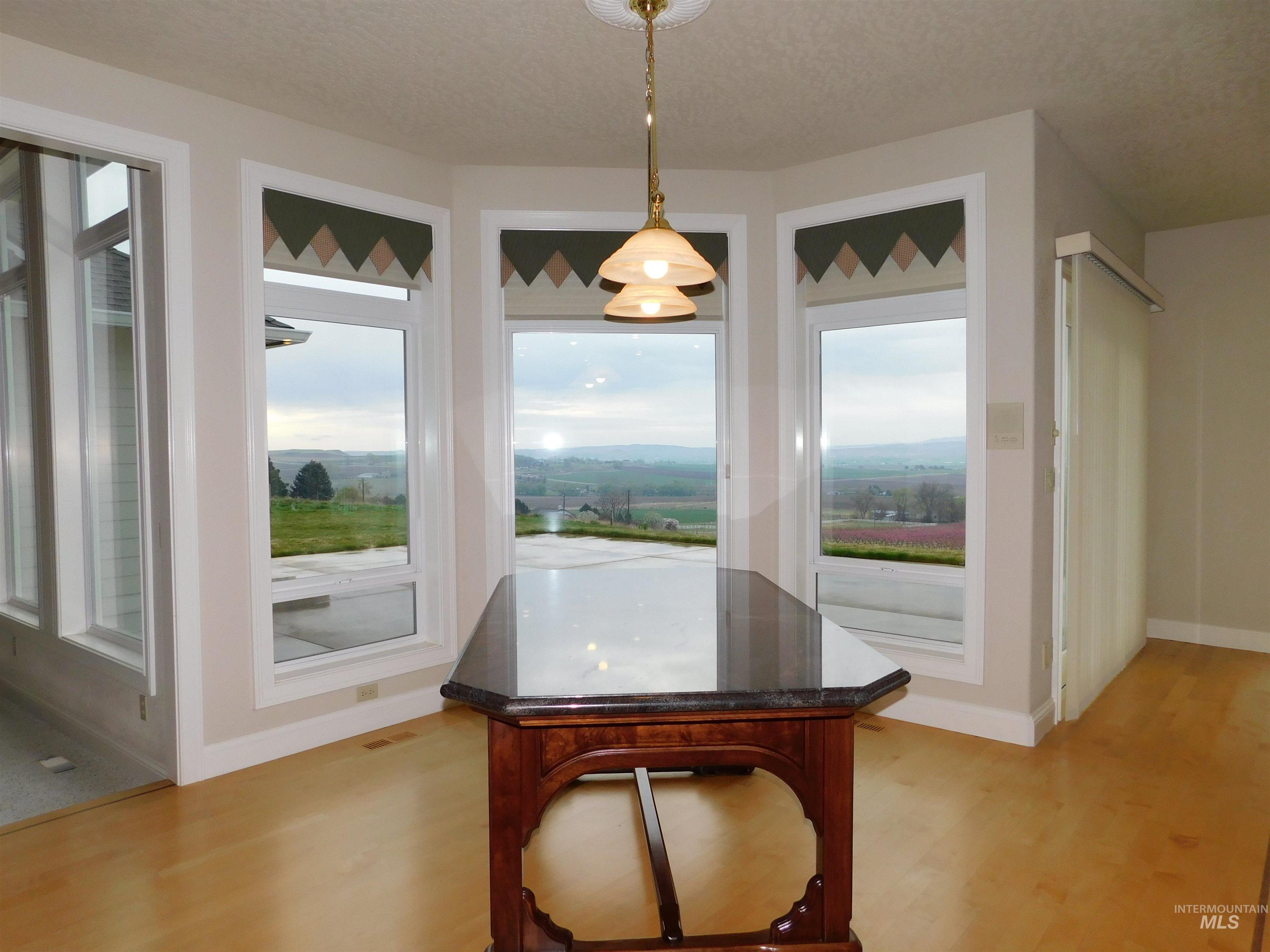17777 Allendale Road Wilder, ID 83676 - Photo 14 of 50 Hardwood floors, picture windows