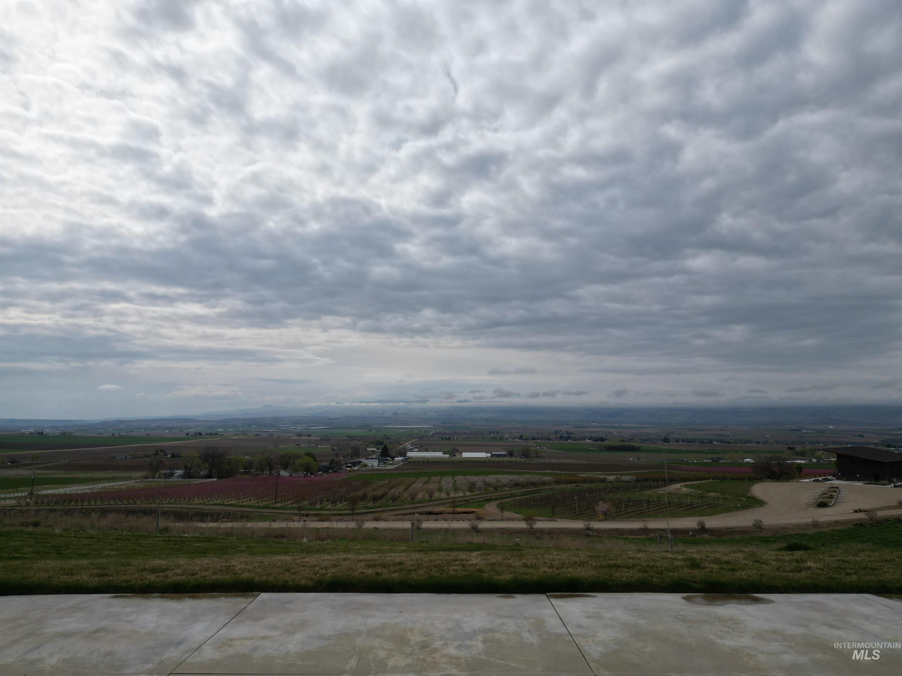 17777 Allendale Road Wilder, ID 83676 - Photo 38 of 50 View of patio / terrace with a rural view and agricultural area