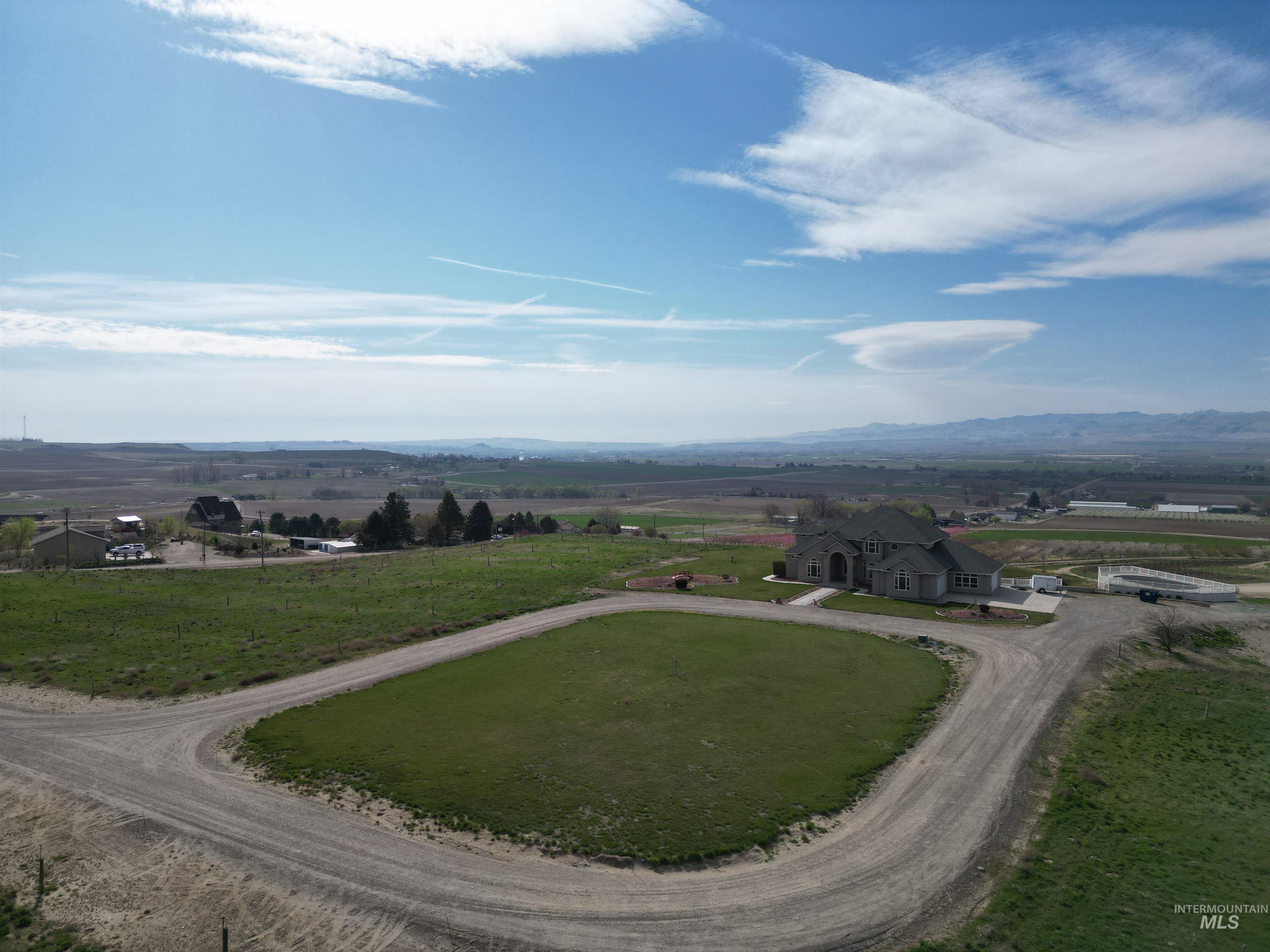 17777 Allendale Road Wilder, ID 83676 - Photo 45 of 50 Aerial view of sparsely populated area with mountains