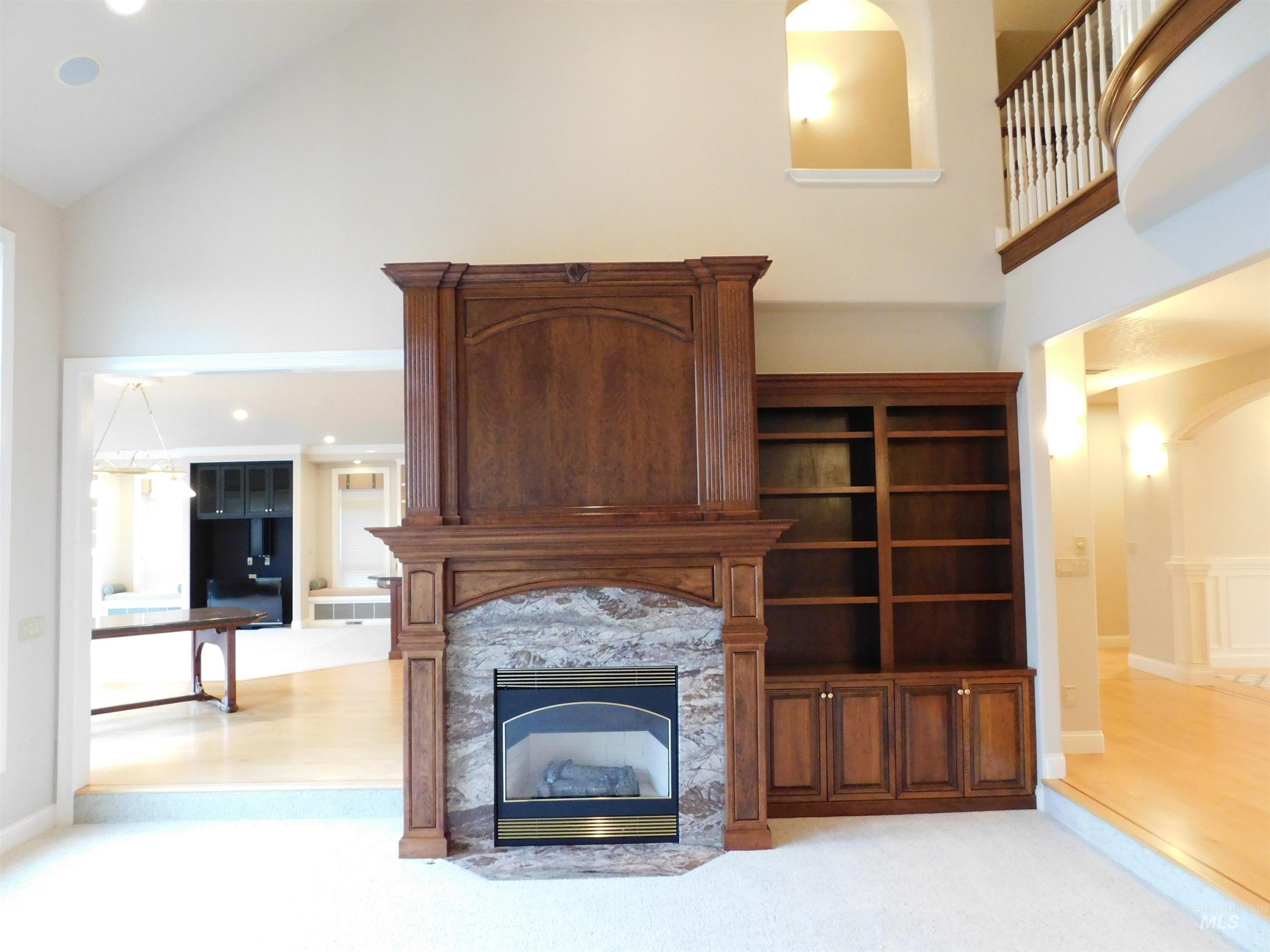 17777 Allendale Road Wilder, ID 83676 - Photo 8 of 50 Living area with a fireplace, recessed lighting, arched walkways, light colored carpet, and vaulted ceiling