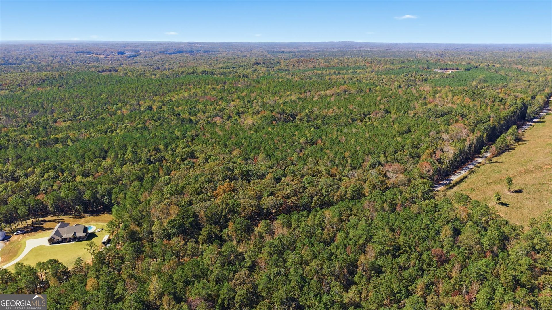 2116 Jones Mill Road Whitesburg, GA 30185 - Photo 5 of 9 a view of a city with lush green forest
