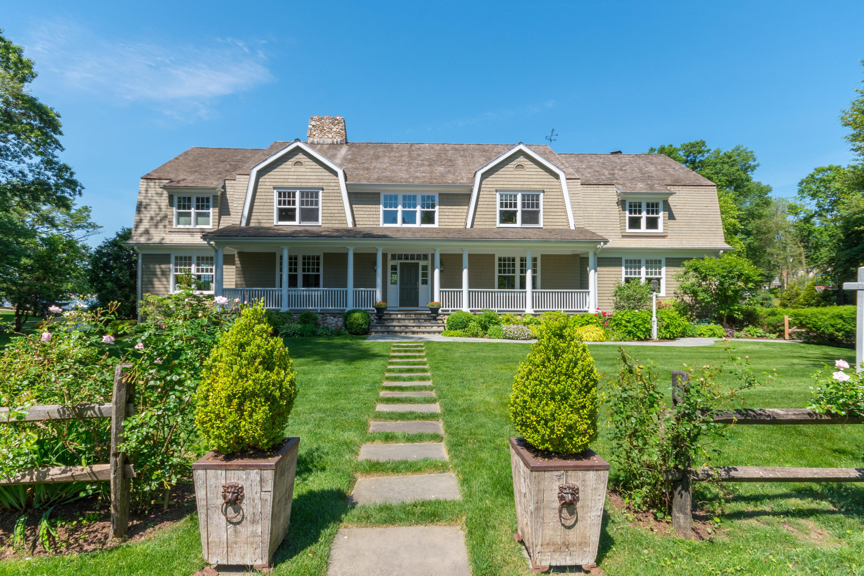 15 Seagate Road Darien, CT 06820 - Photo 2 of 48 a front view of a house with a yard