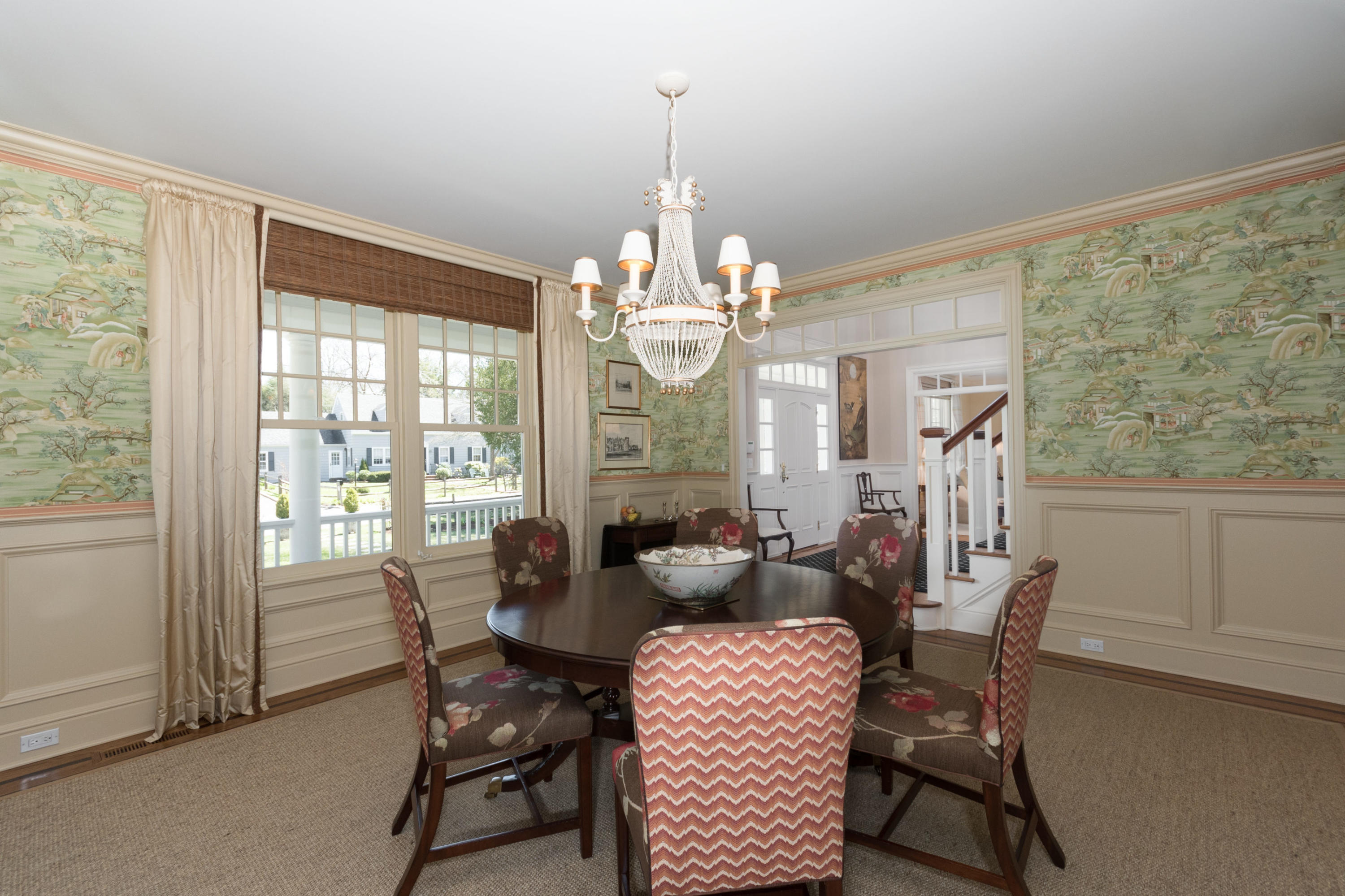 15 Seagate Road Darien, CT 06820 - Photo 14 of 48 a dining room with furniture a chandelier and wooden floor