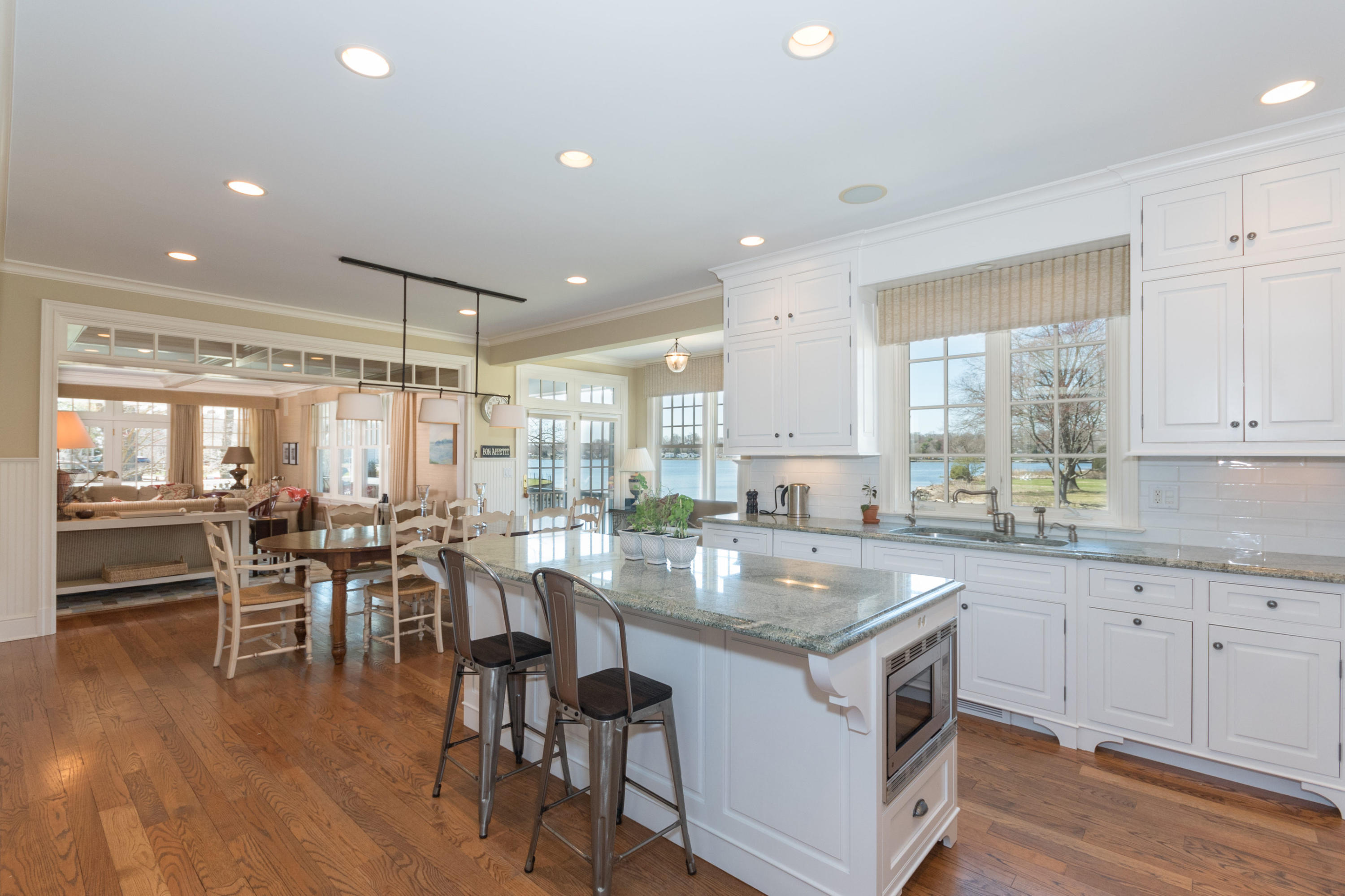 15 Seagate Road Darien, CT 06820 - Photo 15 of 48 a kitchen with center island table and chairs