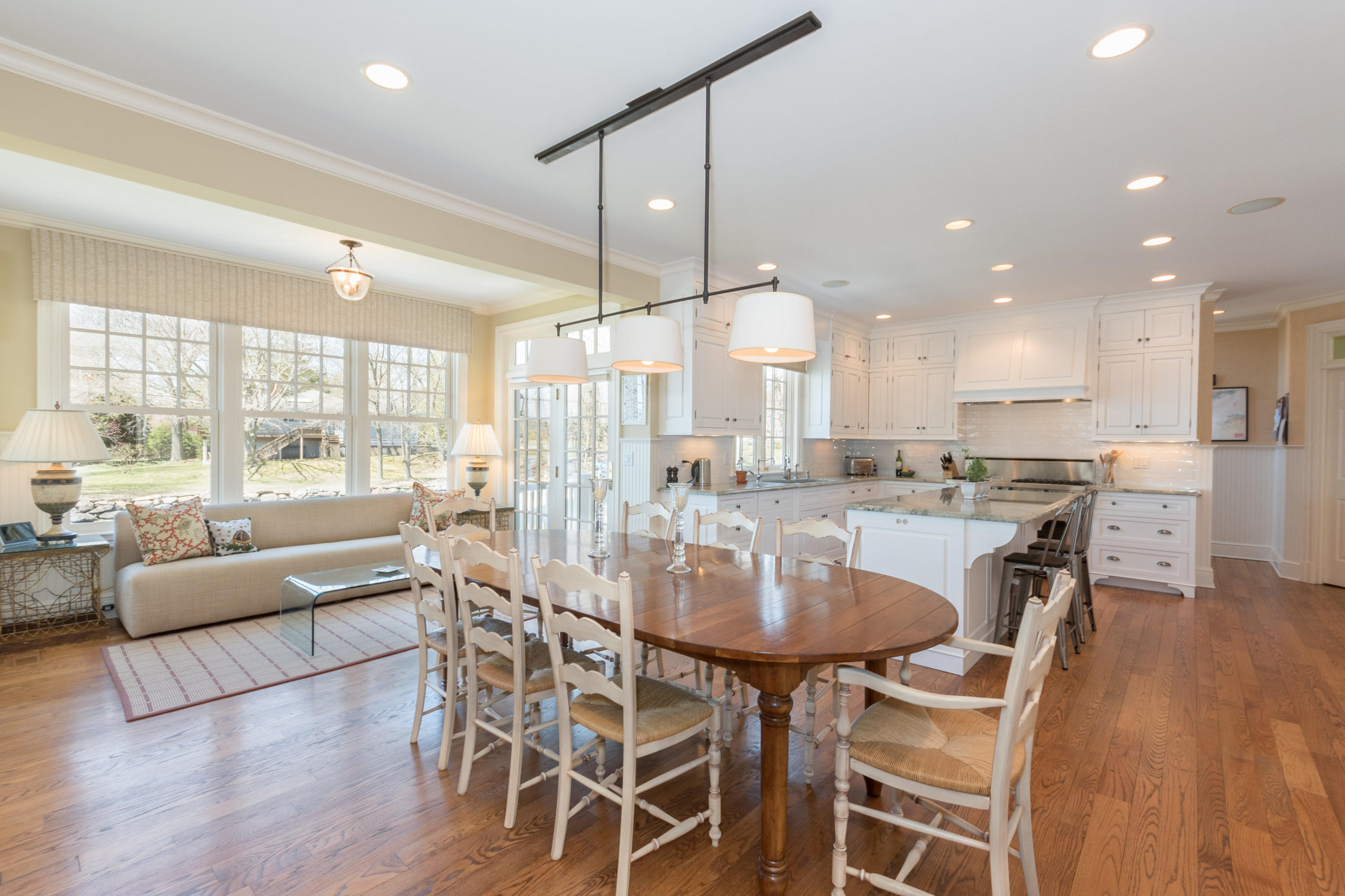 15 Seagate Road Darien, CT 06820 - Photo 17 of 48 a dining room with stainless steel appliances kitchen island granite countertop a table chairs and a living room view