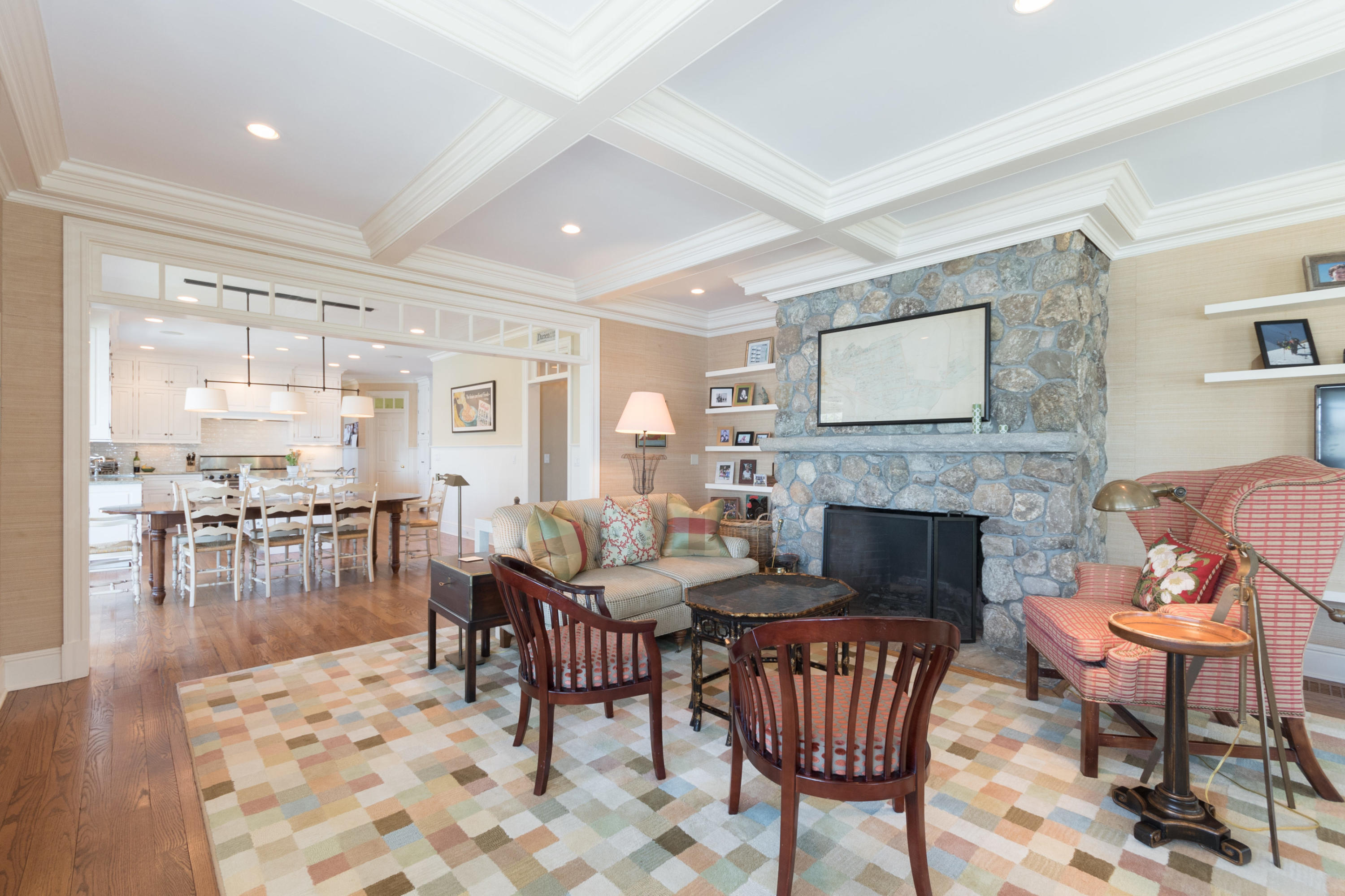 15 Seagate Road Darien, CT 06820 - Photo 20 of 48 a living room with furniture a fireplace and a table