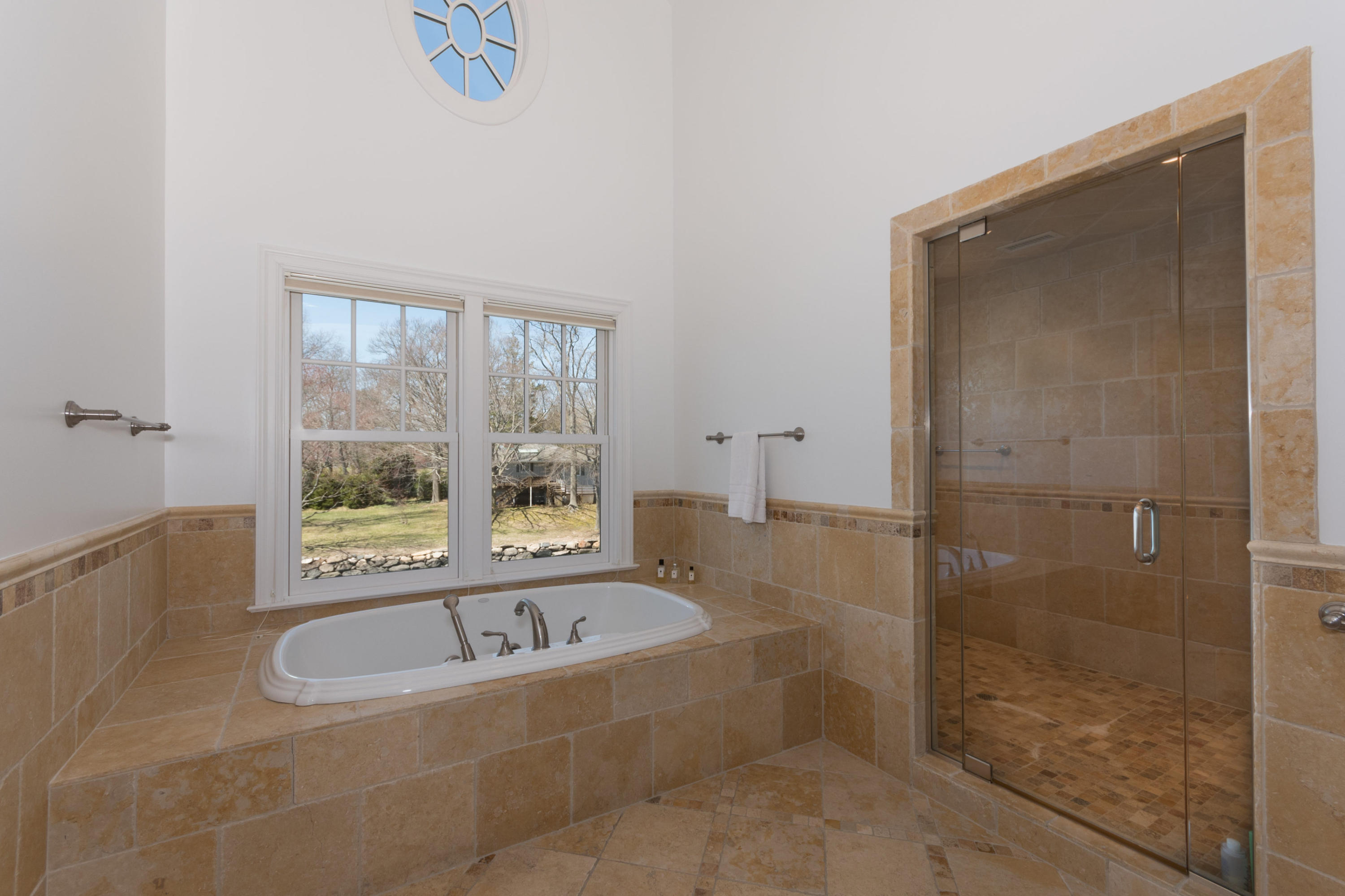 15 Seagate Road Darien, CT 06820 - Photo 27 of 48 a bath tub sitting next to a window