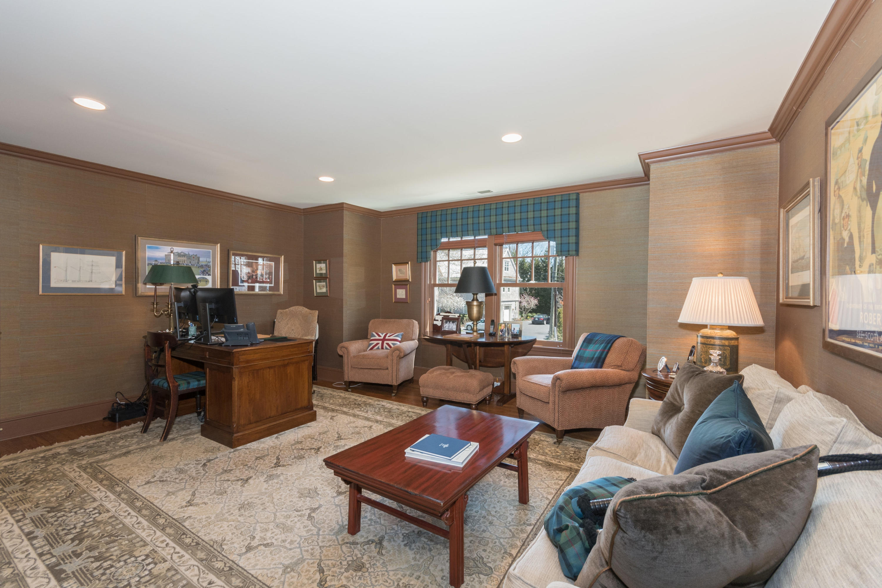 15 Seagate Road Darien, CT 06820 - Photo 30 of 48 a living room with furniture and a lamp on table with wooden floor