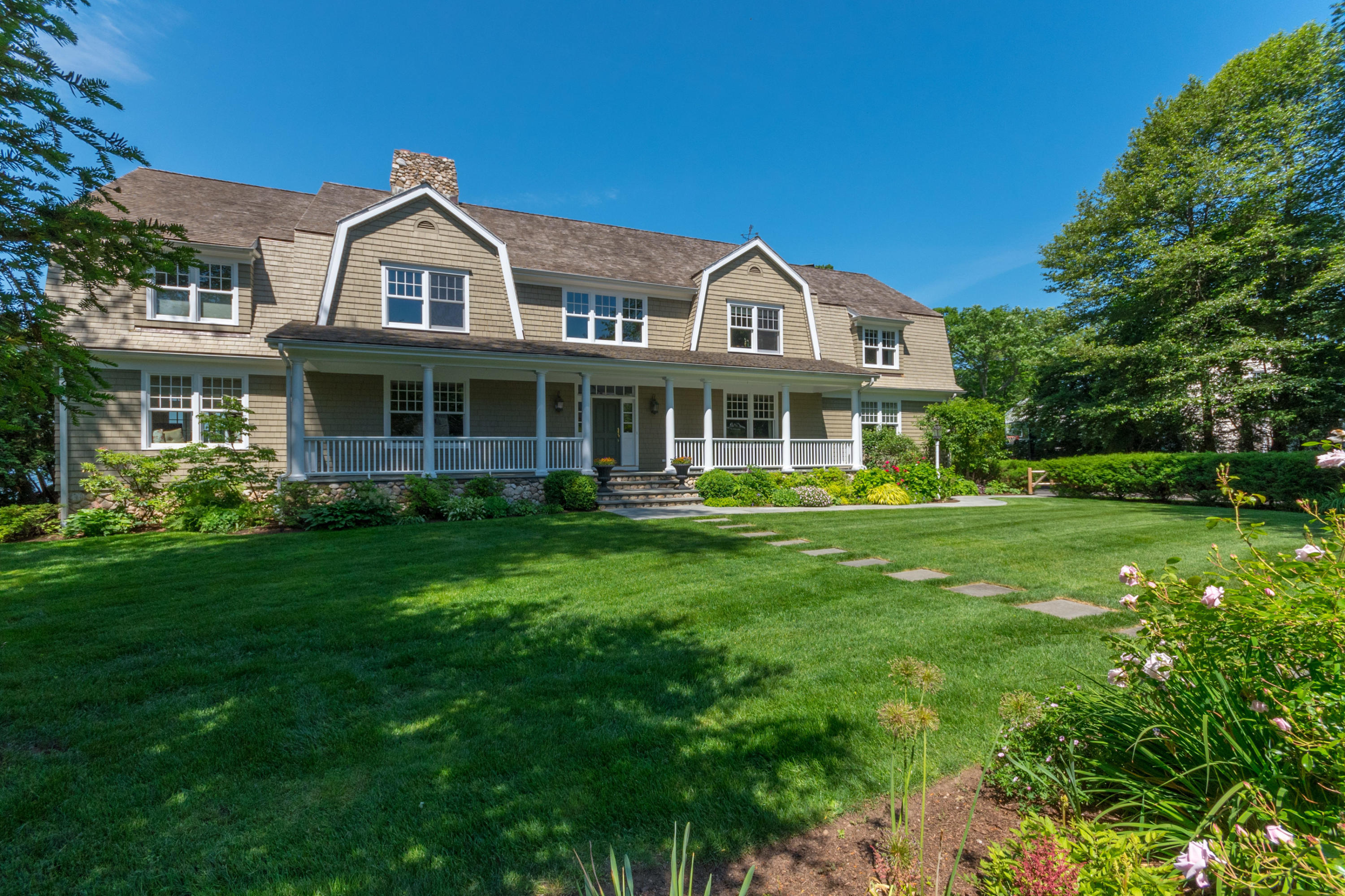 15 Seagate Road Darien, CT 06820 - Photo 4 of 48 a front view of a house with a yard