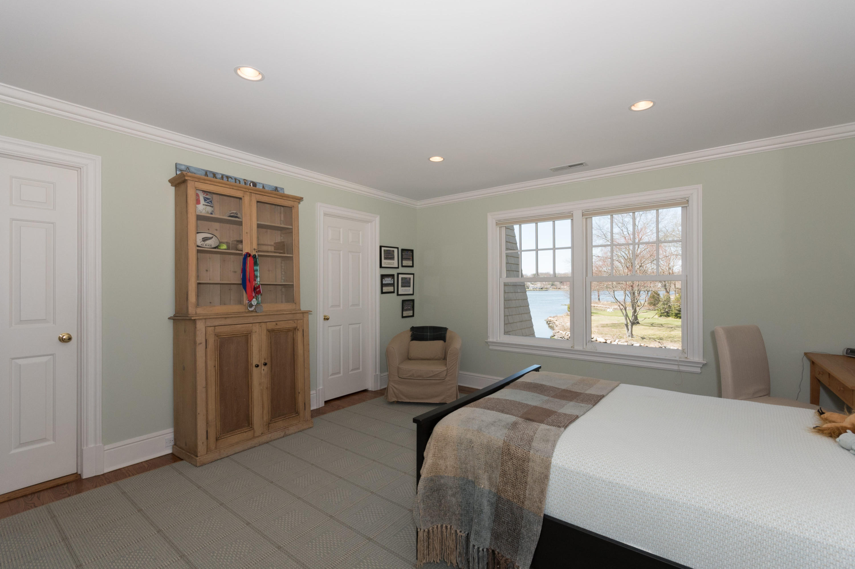 15 Seagate Road Darien, CT 06820 - Photo 32 of 48 a bedroom with a bed and a window