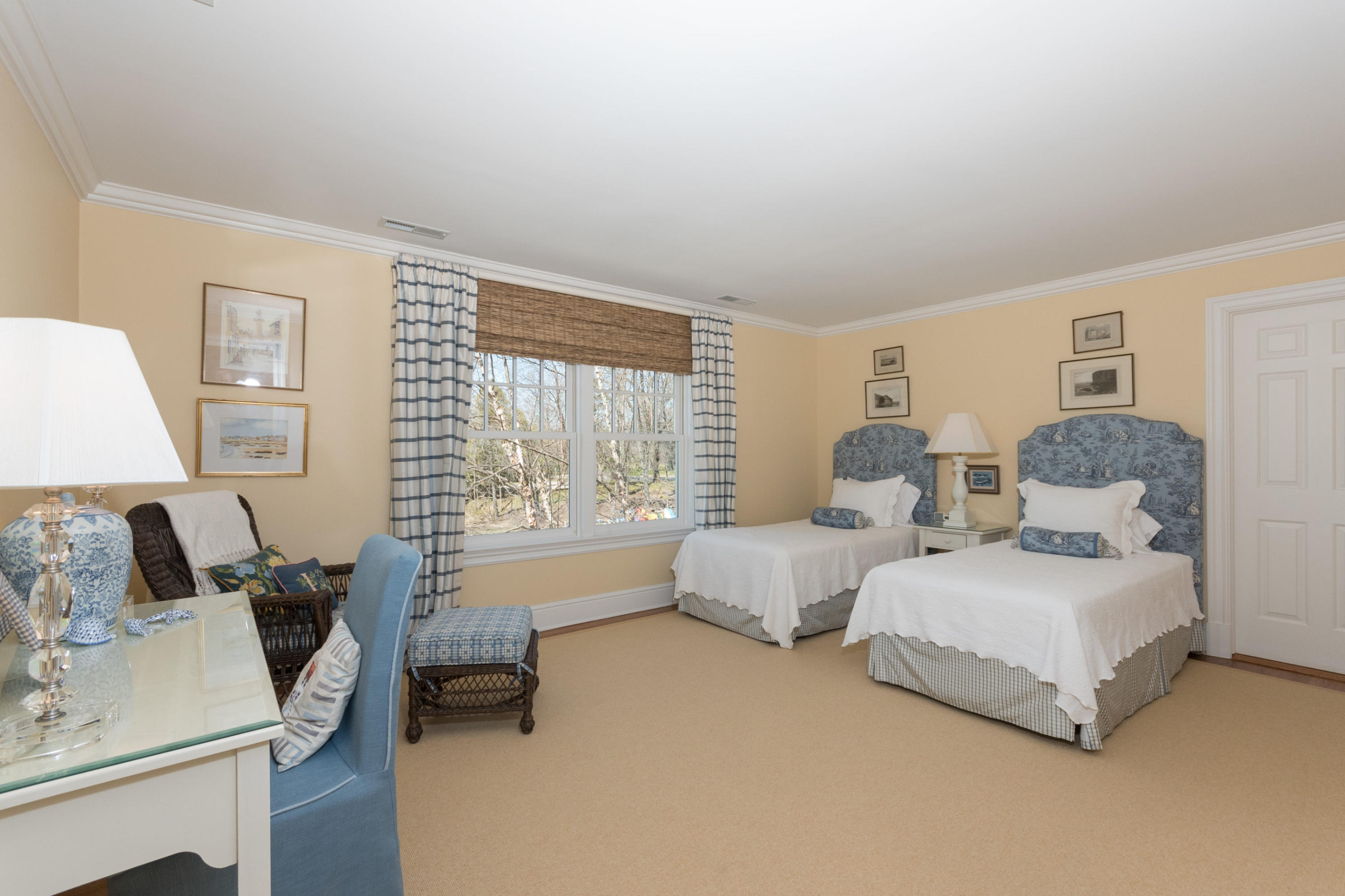 15 Seagate Road Darien, CT 06820 - Photo 33 of 48 a spacious bedroom with two beds and large window