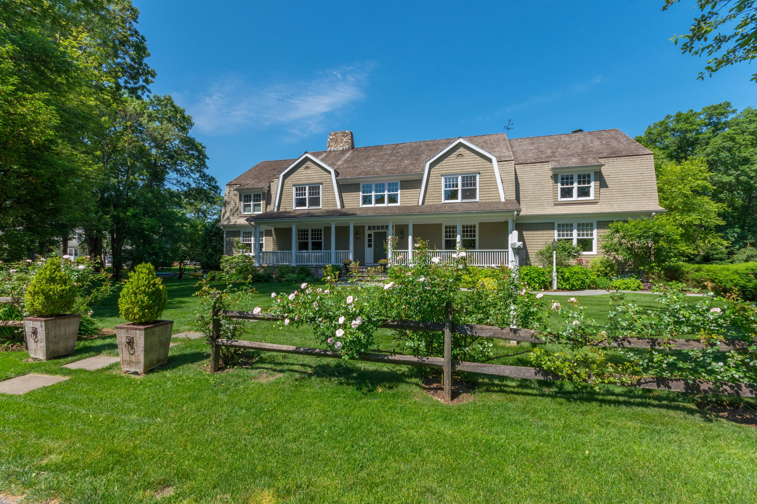 15 Seagate Road Darien, CT 06820 - Photo 5 of 48 a front view of a house with a garden