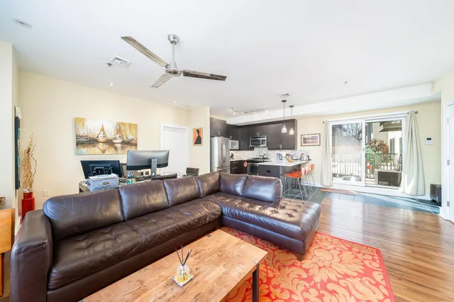 a living room with furniture and a rug