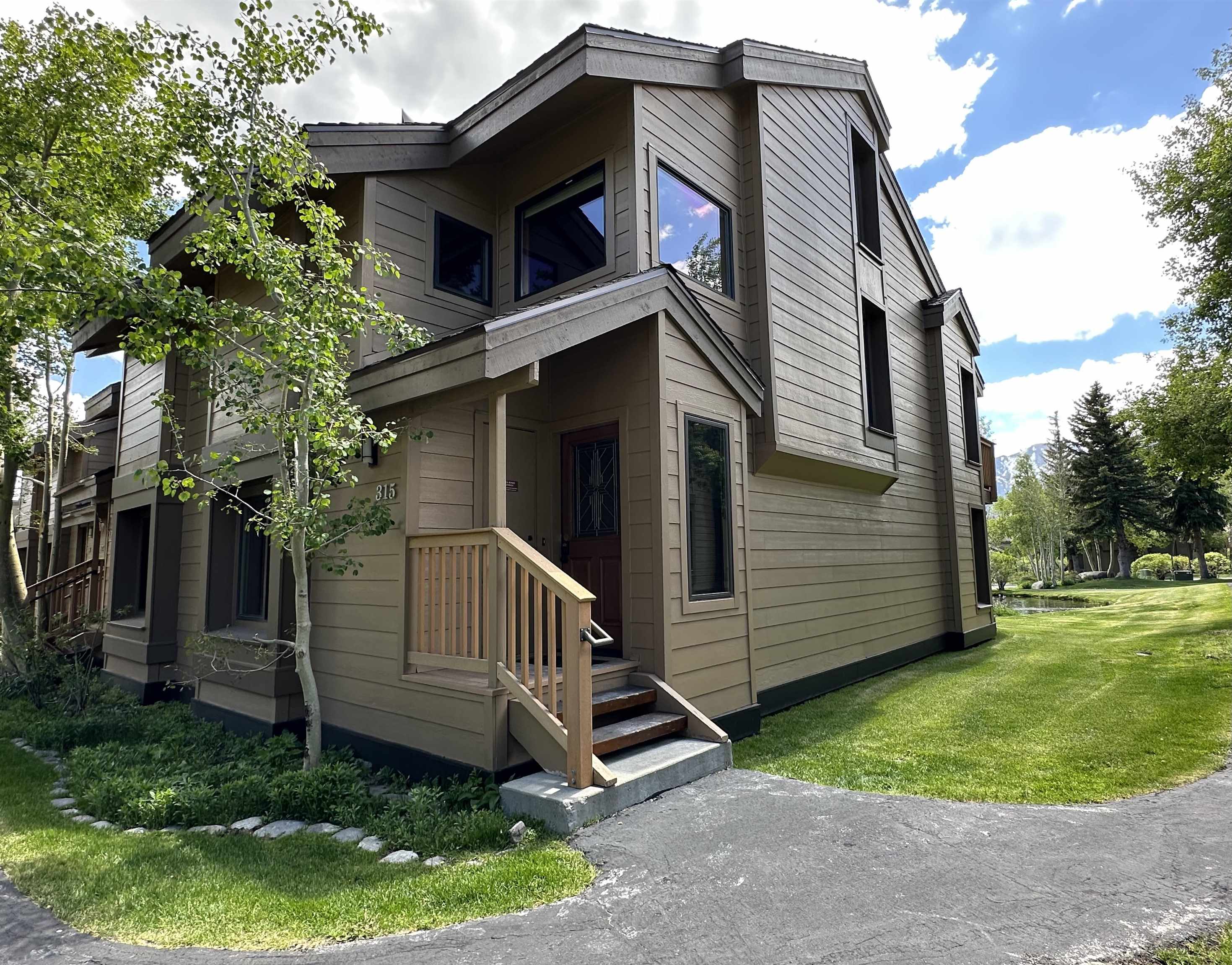 315 Fascination, Unit 315 Mammoth Lakes, CA 93546 - Photo 4 of 44 Multi-story residence featuring horizontal siding and dark trim
