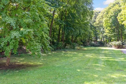a view of outdoor space with deck and yard