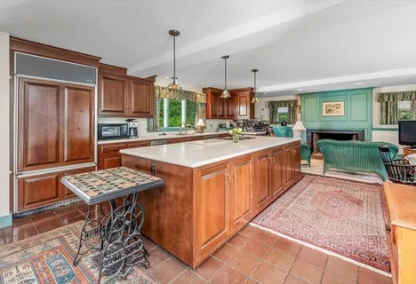 a kitchen with a sink stove and wooden cabinets