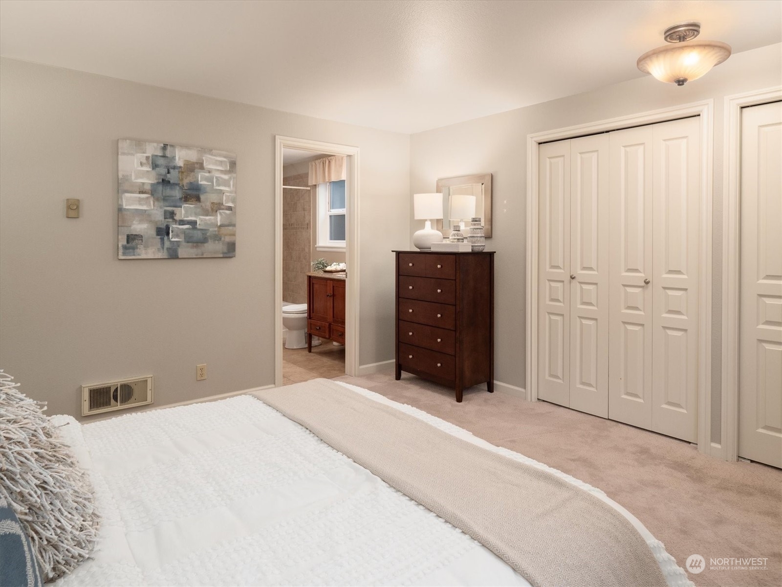 1622 243rd Place Southeast Bothell, WA 98021 - Photo 16 of 25 a bedroom with a bed and a painting on the wall