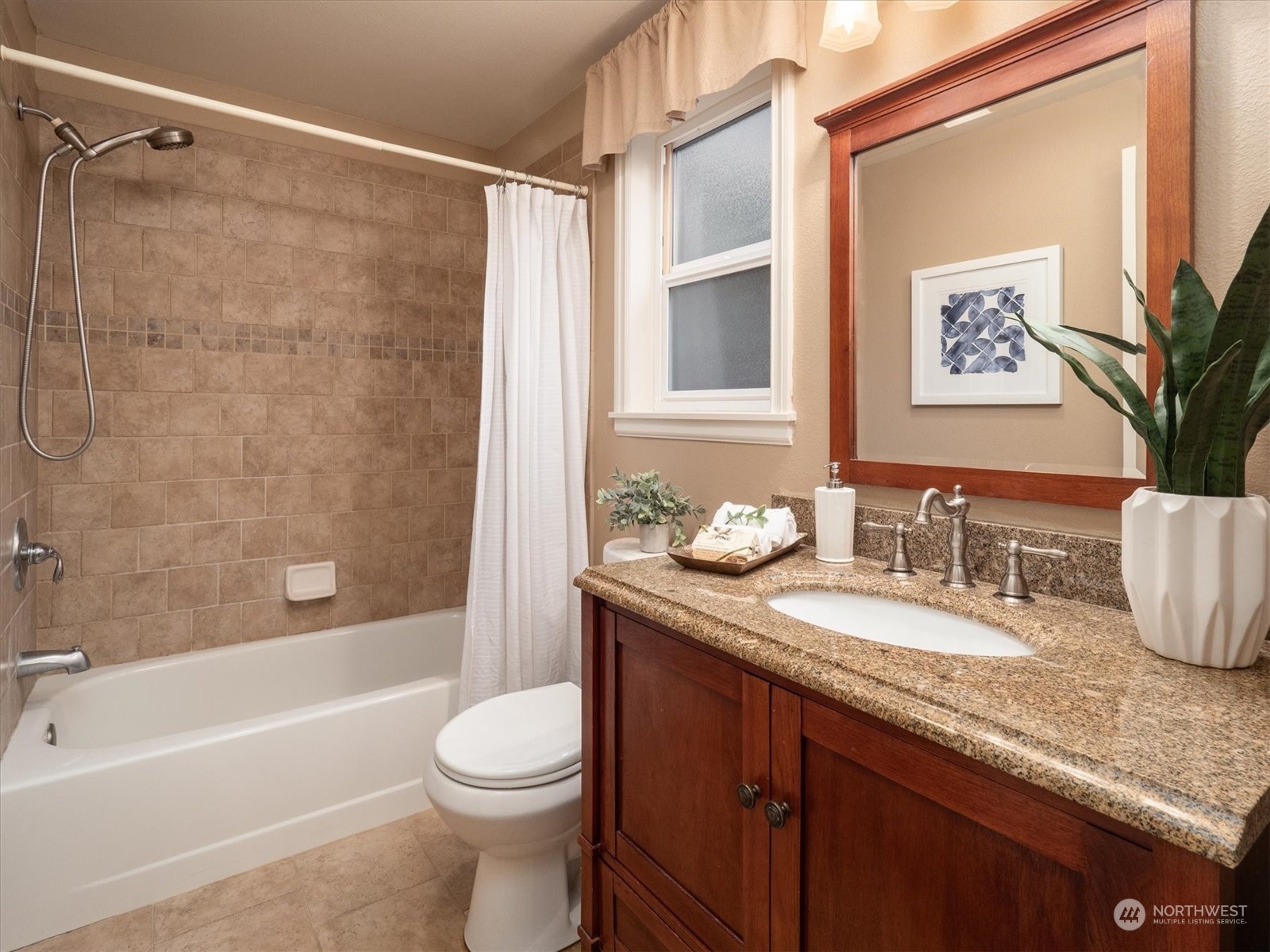 1622 243rd Place Southeast Bothell, WA 98021 - Photo 17 of 25 a bathroom with a granite countertop sink toilet and shower