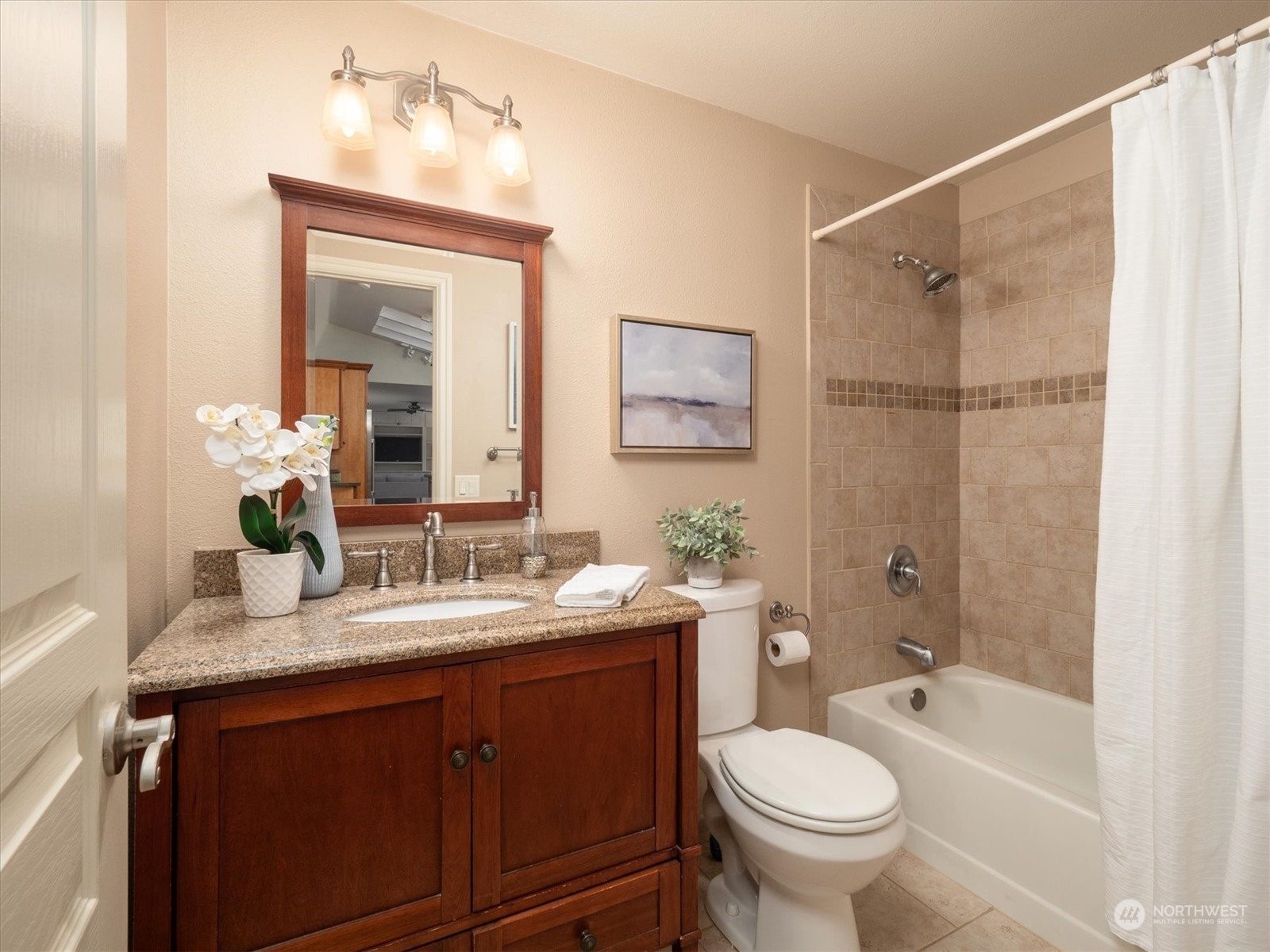 1622 243rd Place Southeast Bothell, WA 98021 - Photo 20 of 25 a bathroom with a granite countertop sink toilet and shower