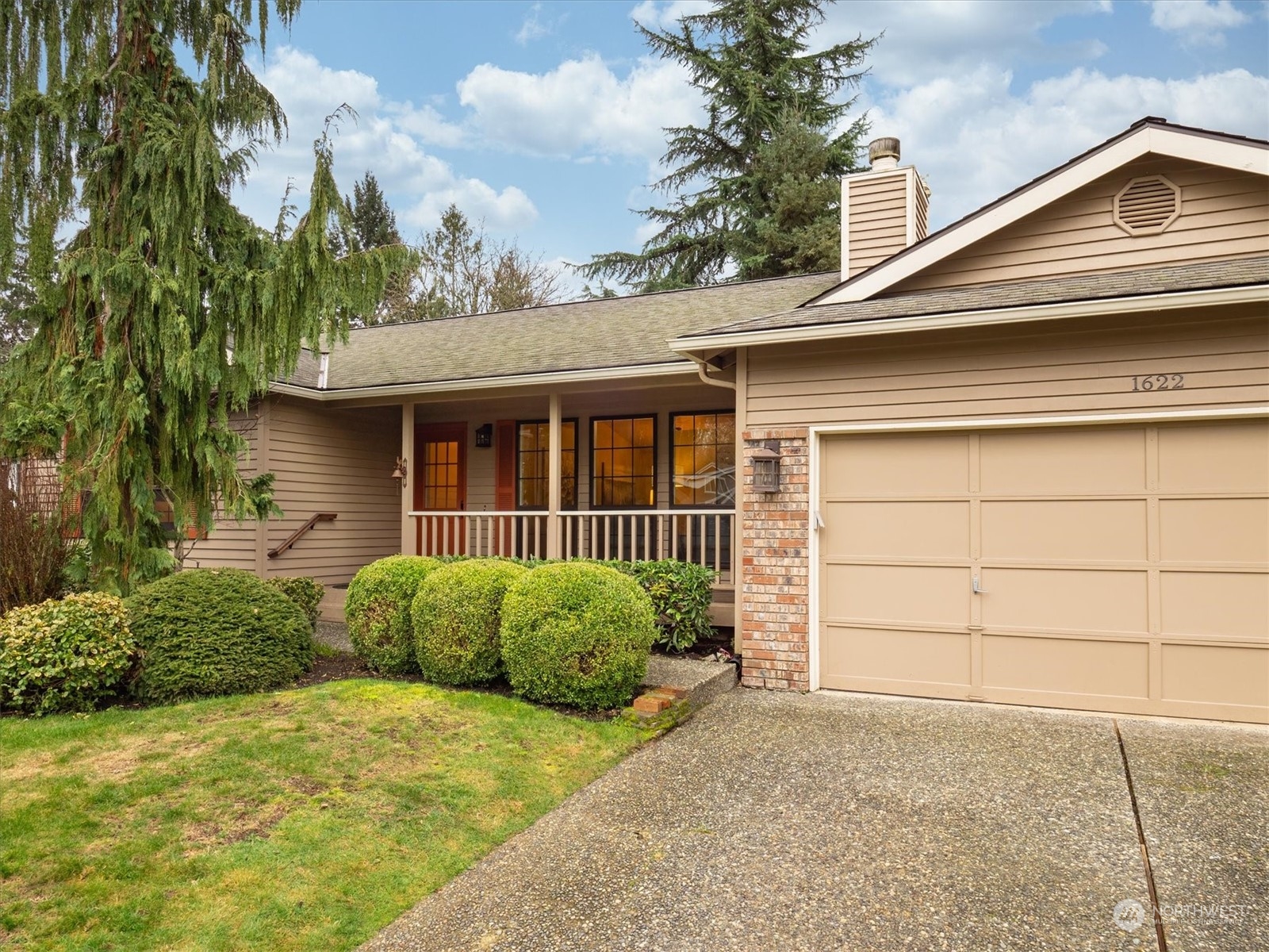 1622 243rd Place Southeast Bothell, WA 98021 - Photo 2 of 25 a front view of a house with a garage