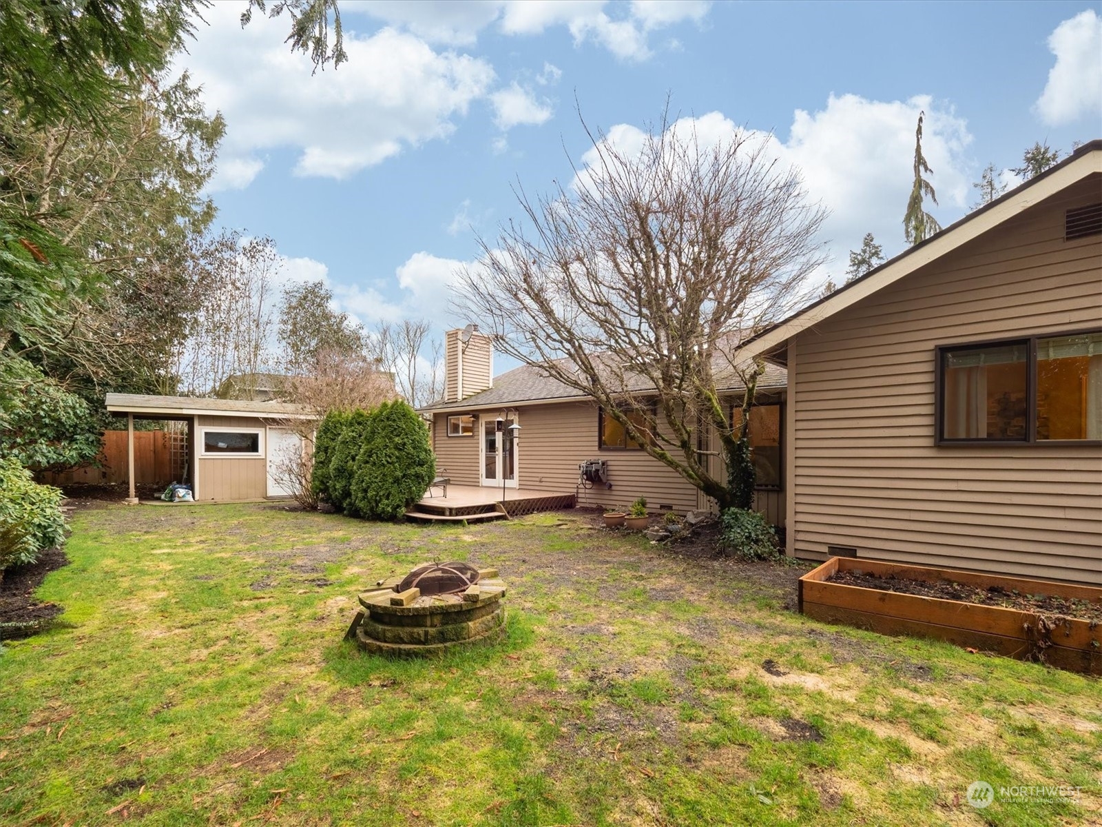 1622 243rd Place Southeast Bothell, WA 98021 - Photo 21 of 25 a view of a house with a yard