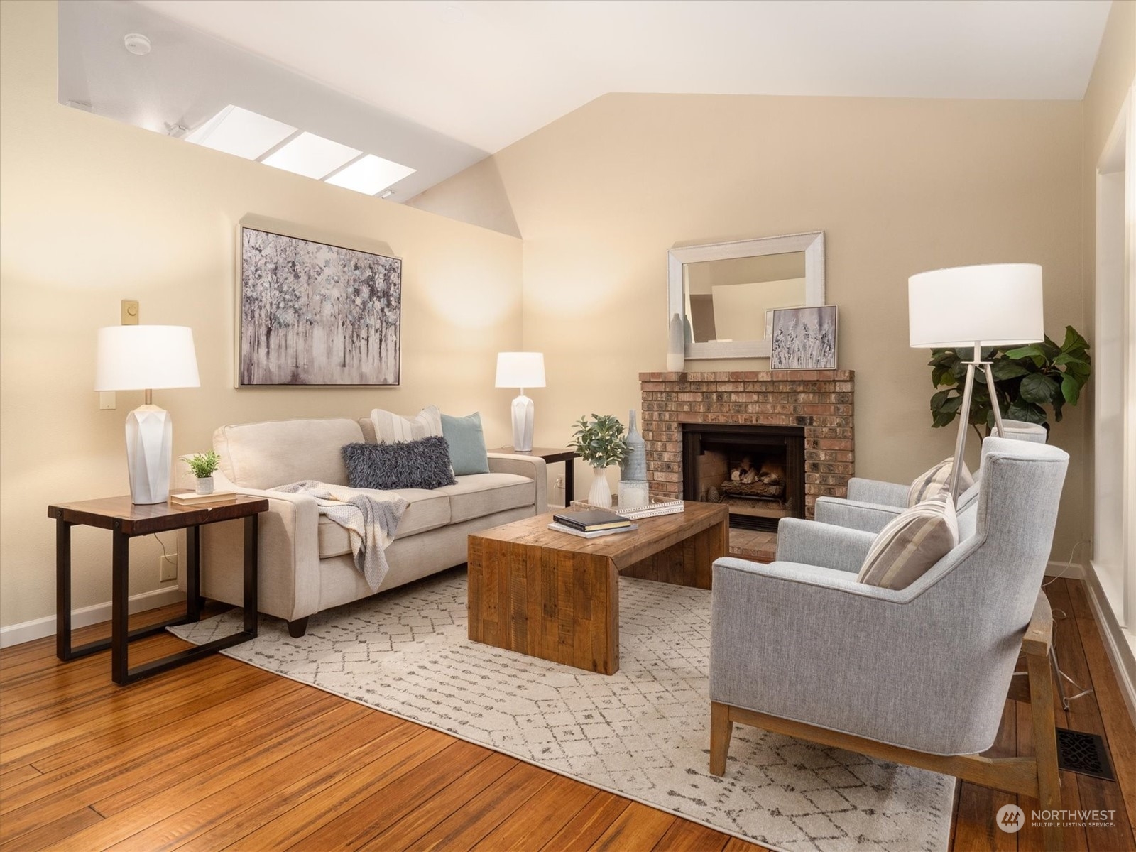 1622 243rd Place Southeast Bothell, WA 98021 - Photo 4 of 25 a living room with furniture and a fireplace